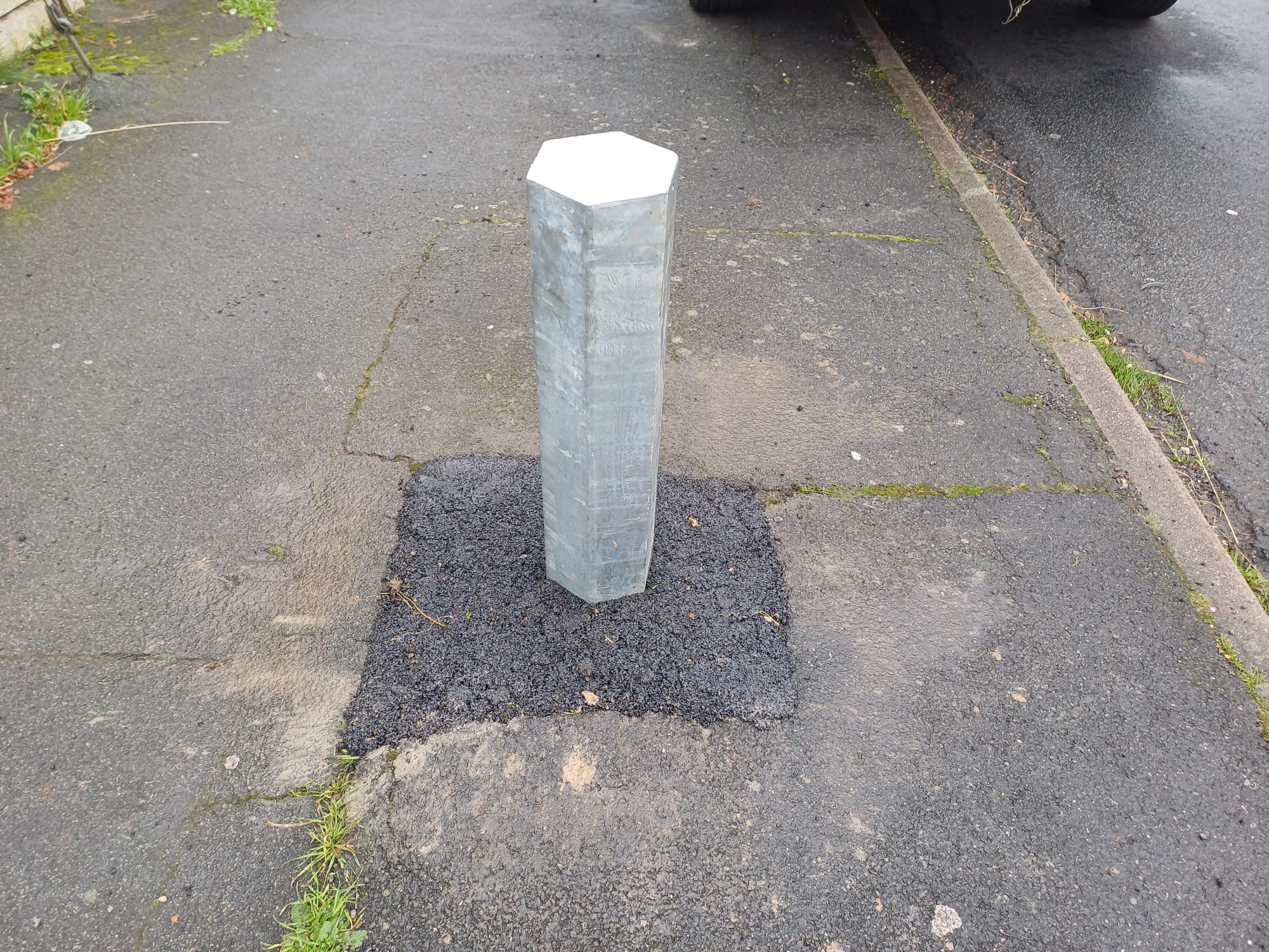 Yellow height restriction barrier at Amesbury Town Council car park.