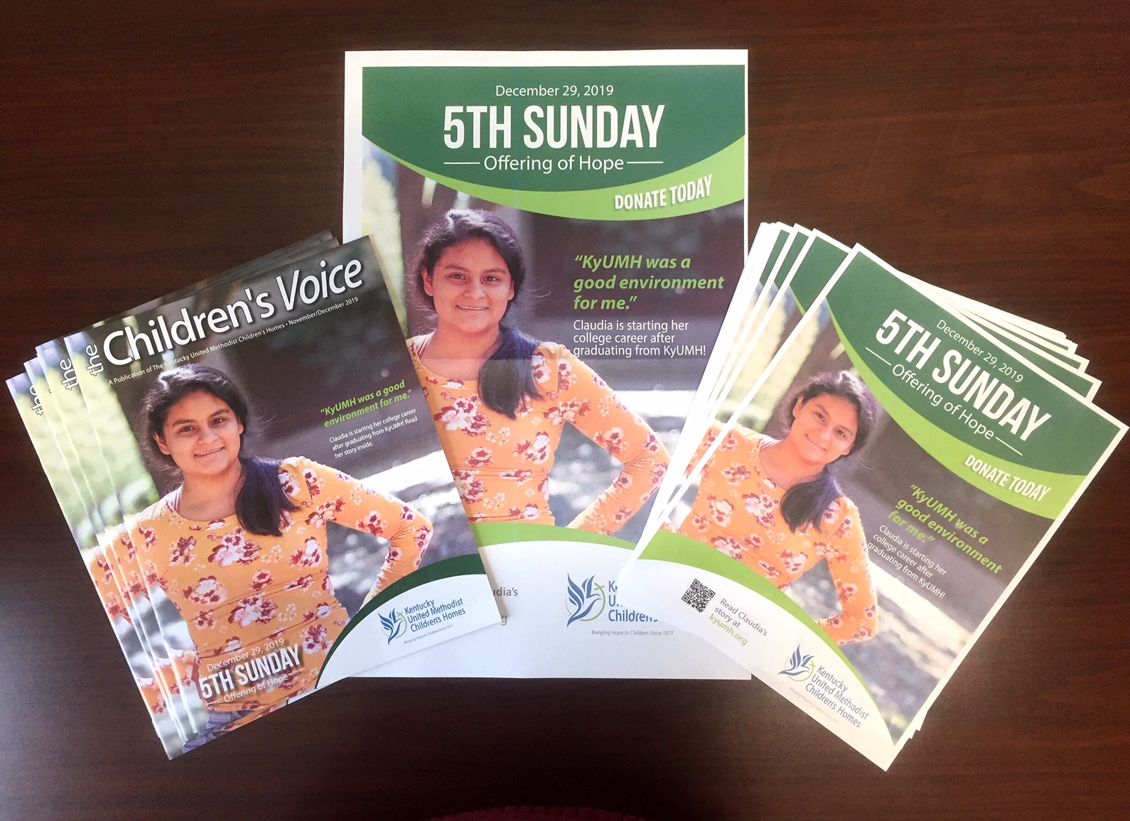 Printed brochures and flyers for Kentucky United Methodist Children's Homes featuring a smiling girl in a yellow floral top and promoting the 5th Sunday Offering of Hope event on December 29, 2019.