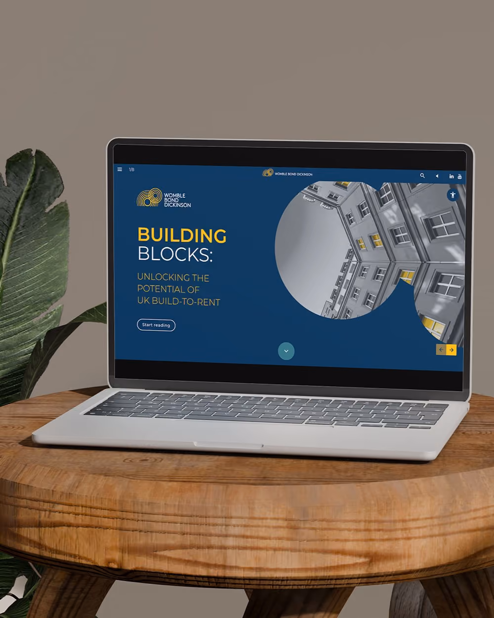 Mockup of a laptop and phone showing a webpage banner design and social media post.