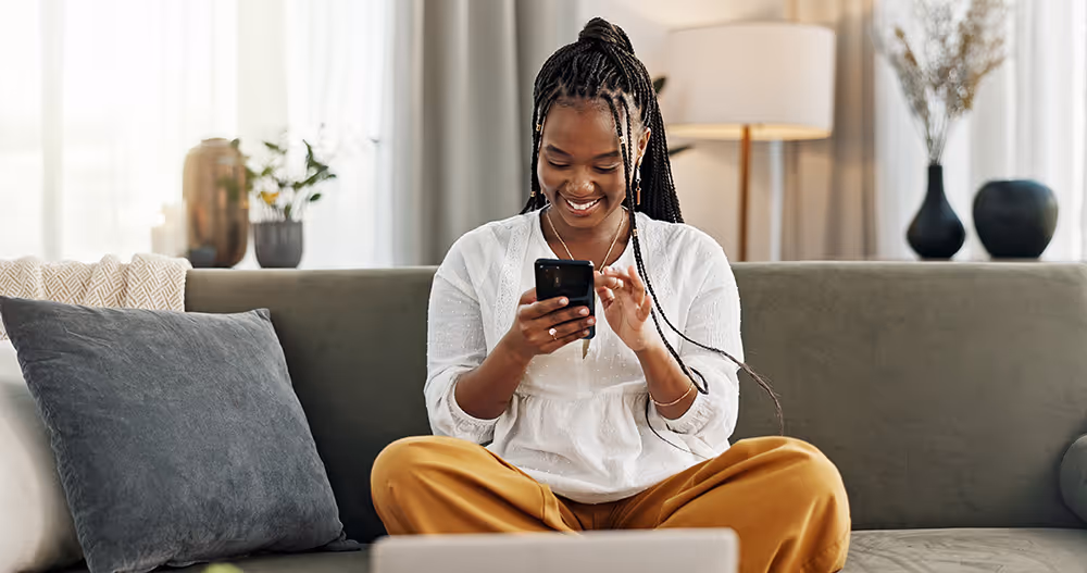 Woman on mobile phone smiling