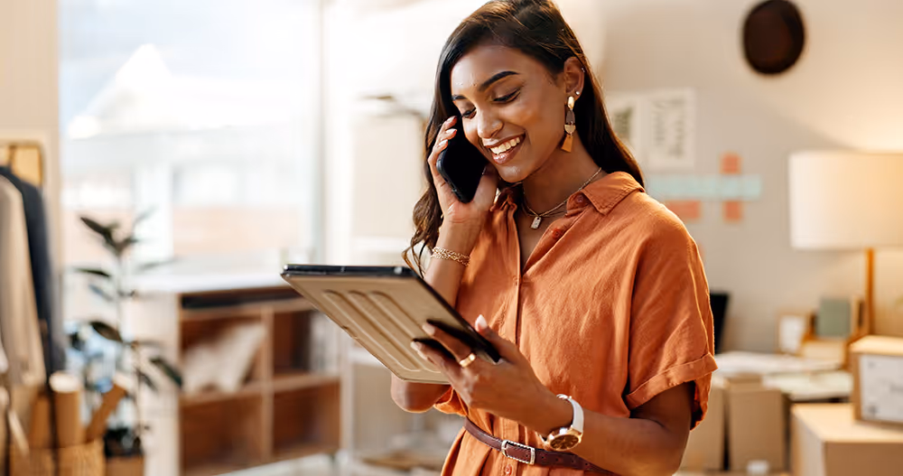 Woman on mobile phone smiling