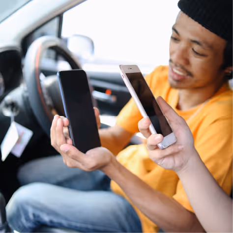 Customer paying for their taxi journey using a mobile phone