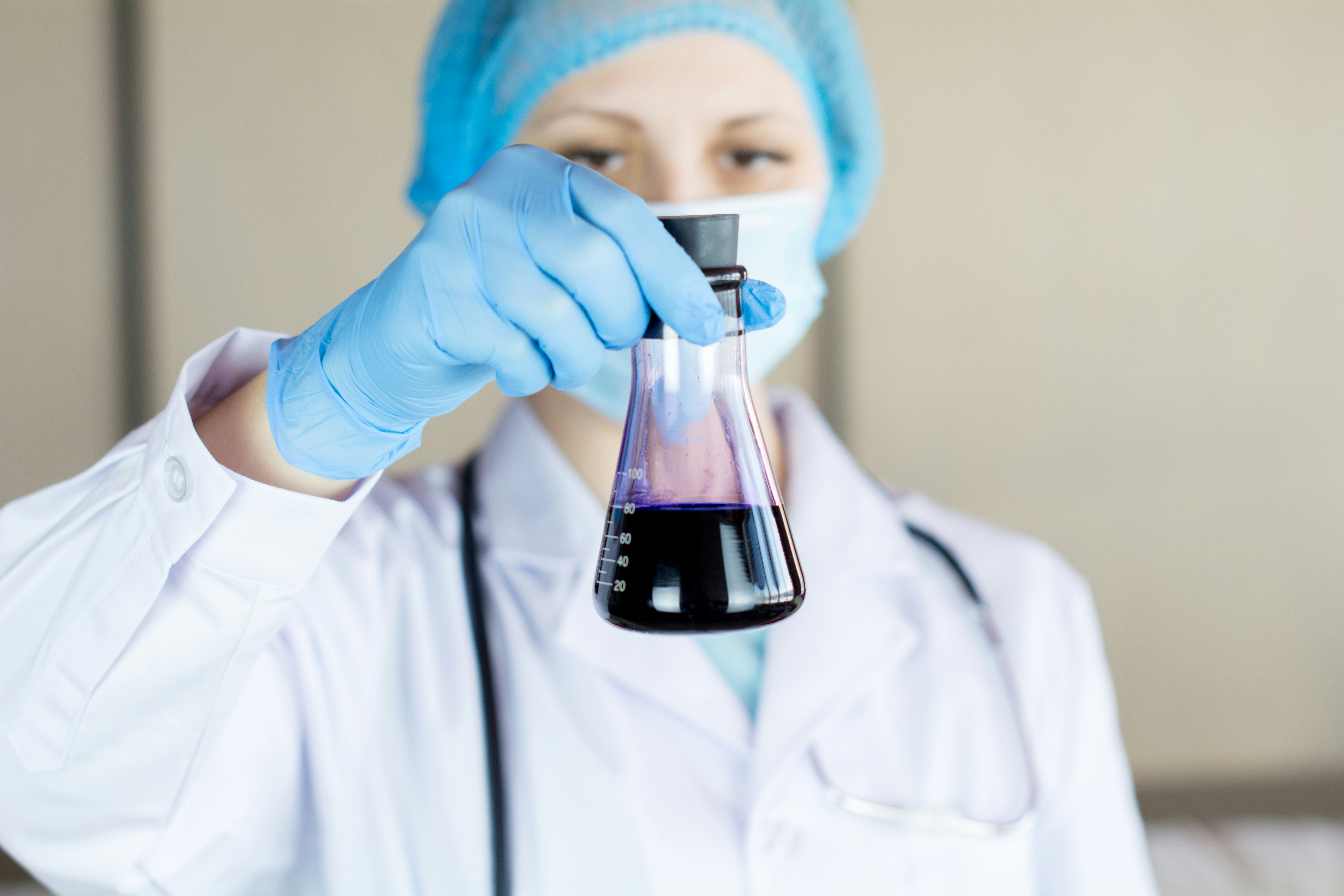 Cosmetic chemist reviewing a formulation during a clean beauty reformulation