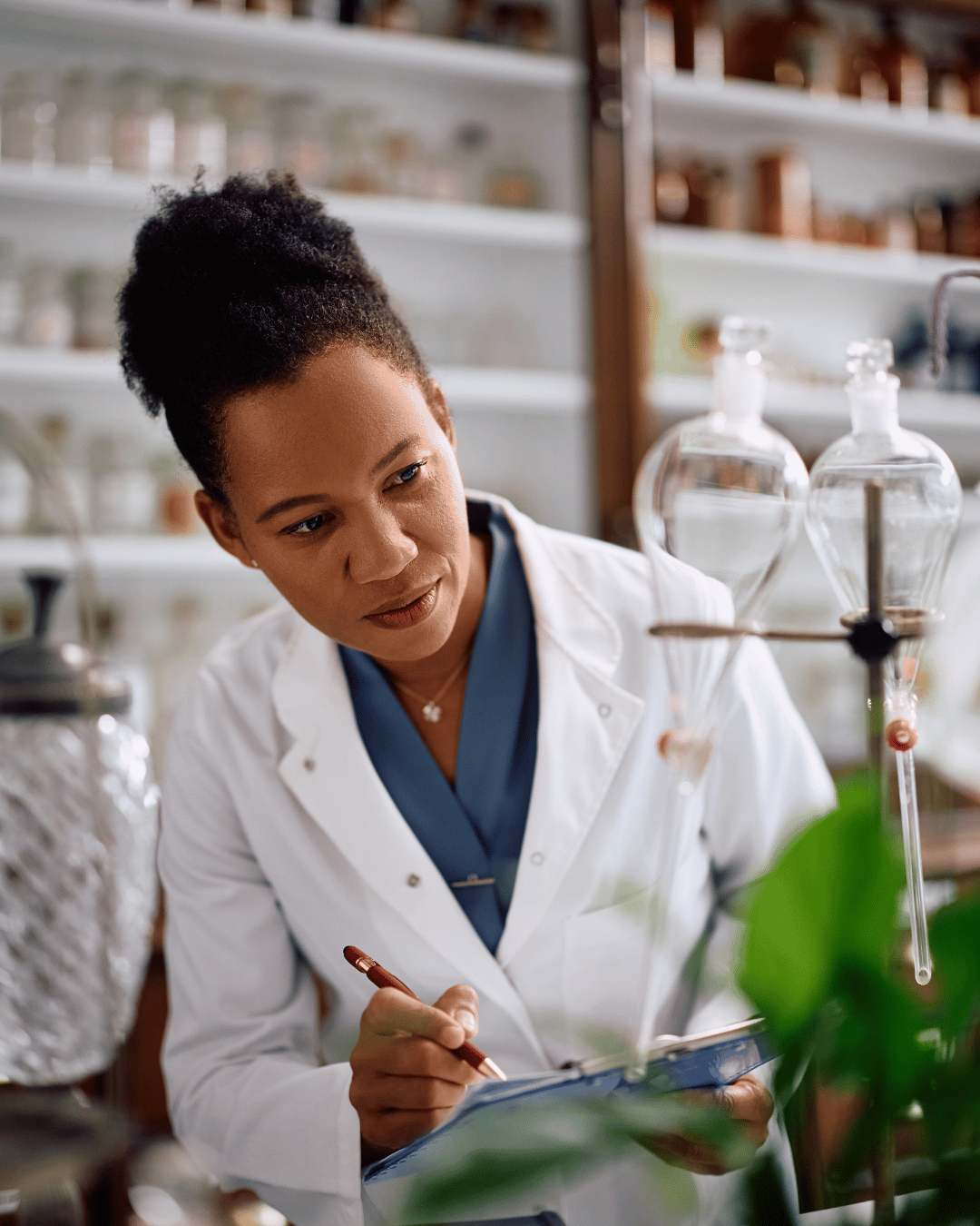 Food scientist reviewing ingredients and formulation samples in a laboratory, representing the impact of changing food additive rules on product development.