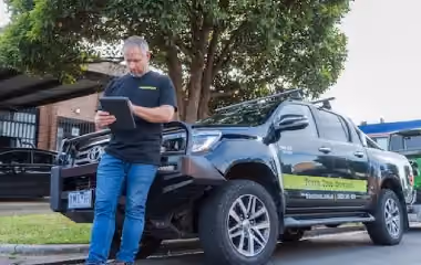 Trav’s Tree Services arborist reviewing council approval requirements for tree removal on private property in Victoria.