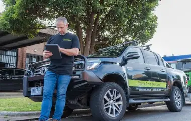 Trav’s Tree Services arborist reviewing council approval requirements for tree removal on private property in Victoria.
