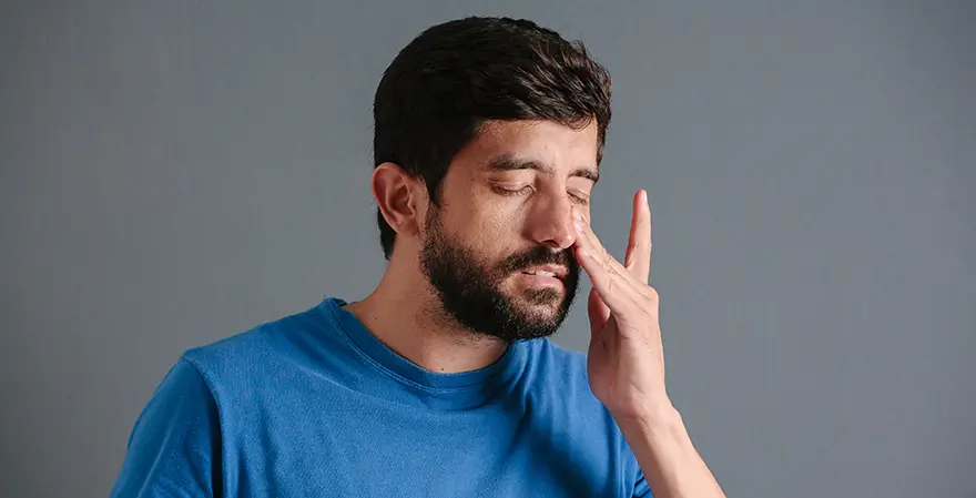 person suffering from sinus pain