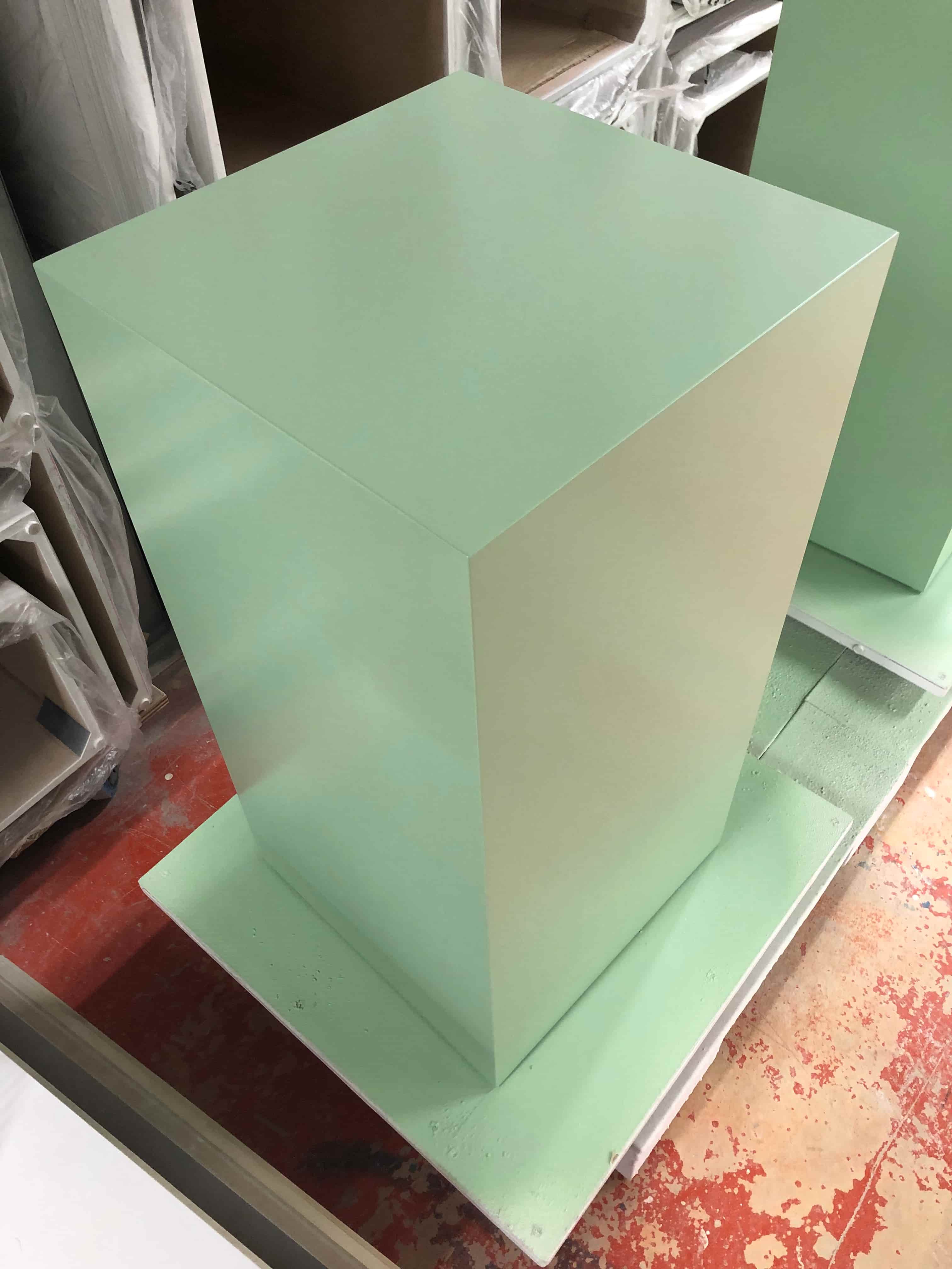 Green satin plinths