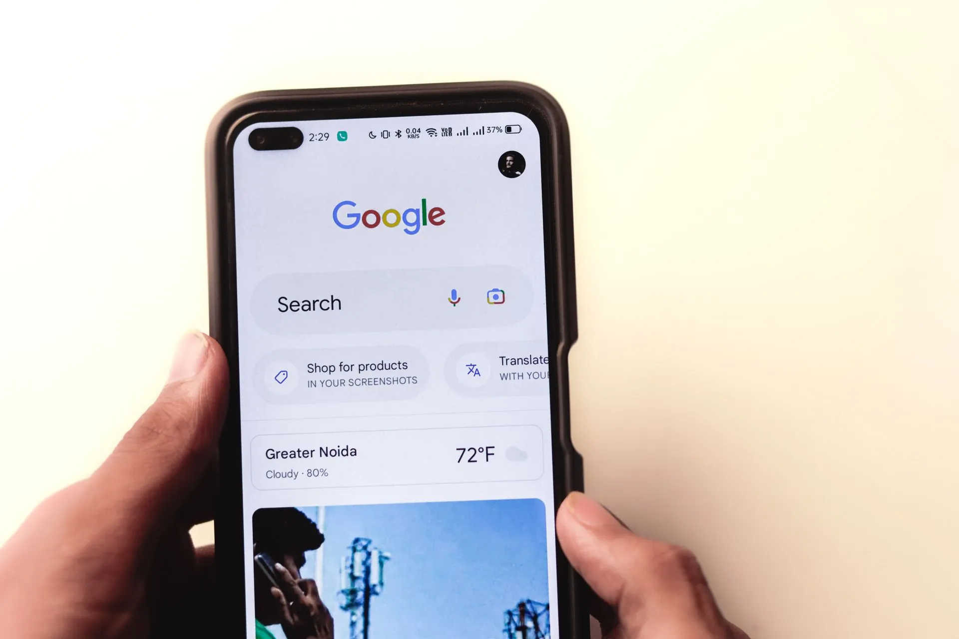 Person using the Google Search app on a smartphone for online research and content discovery