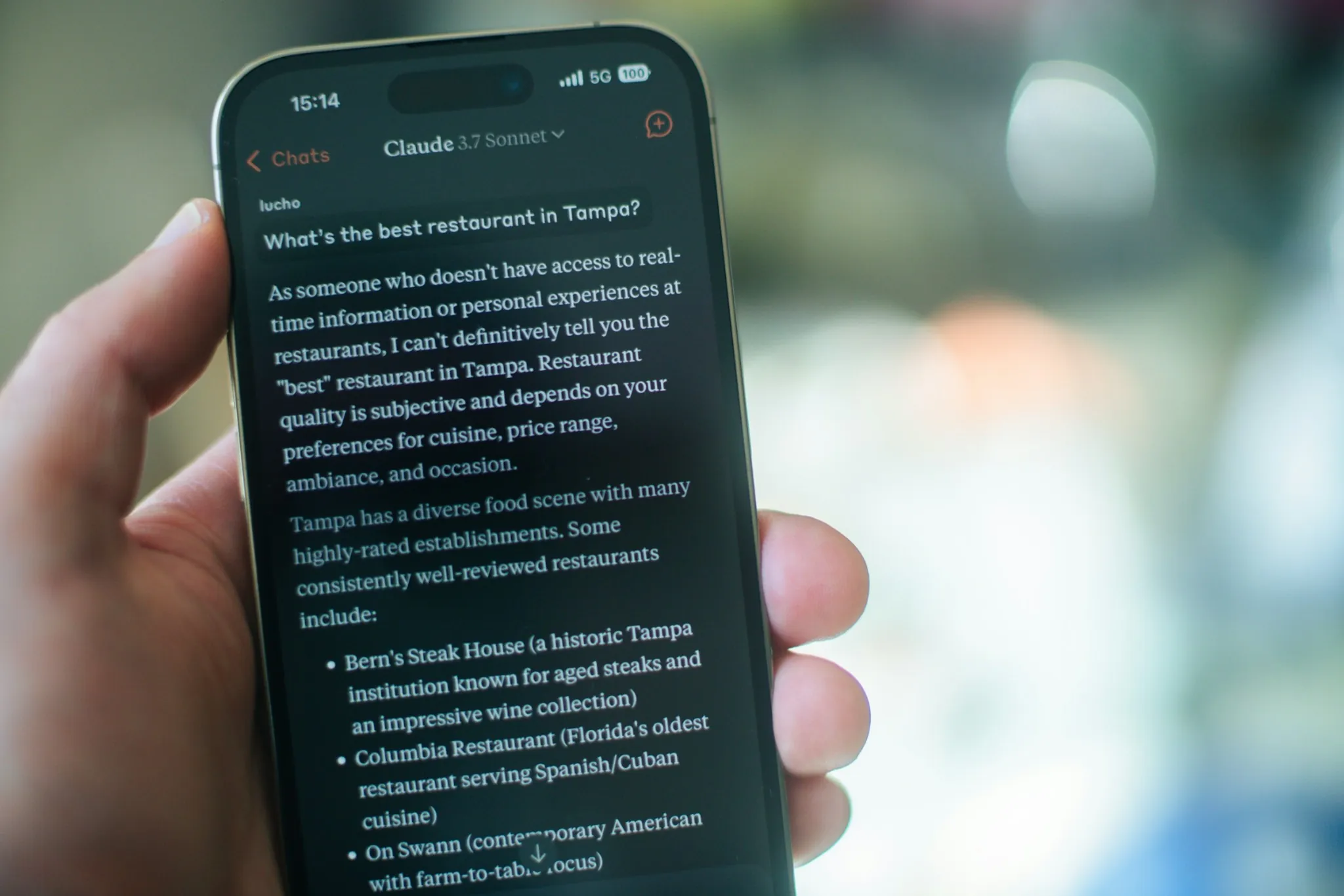Smartphone displaying an AI assistant answering a local search query for restaurant recommendations