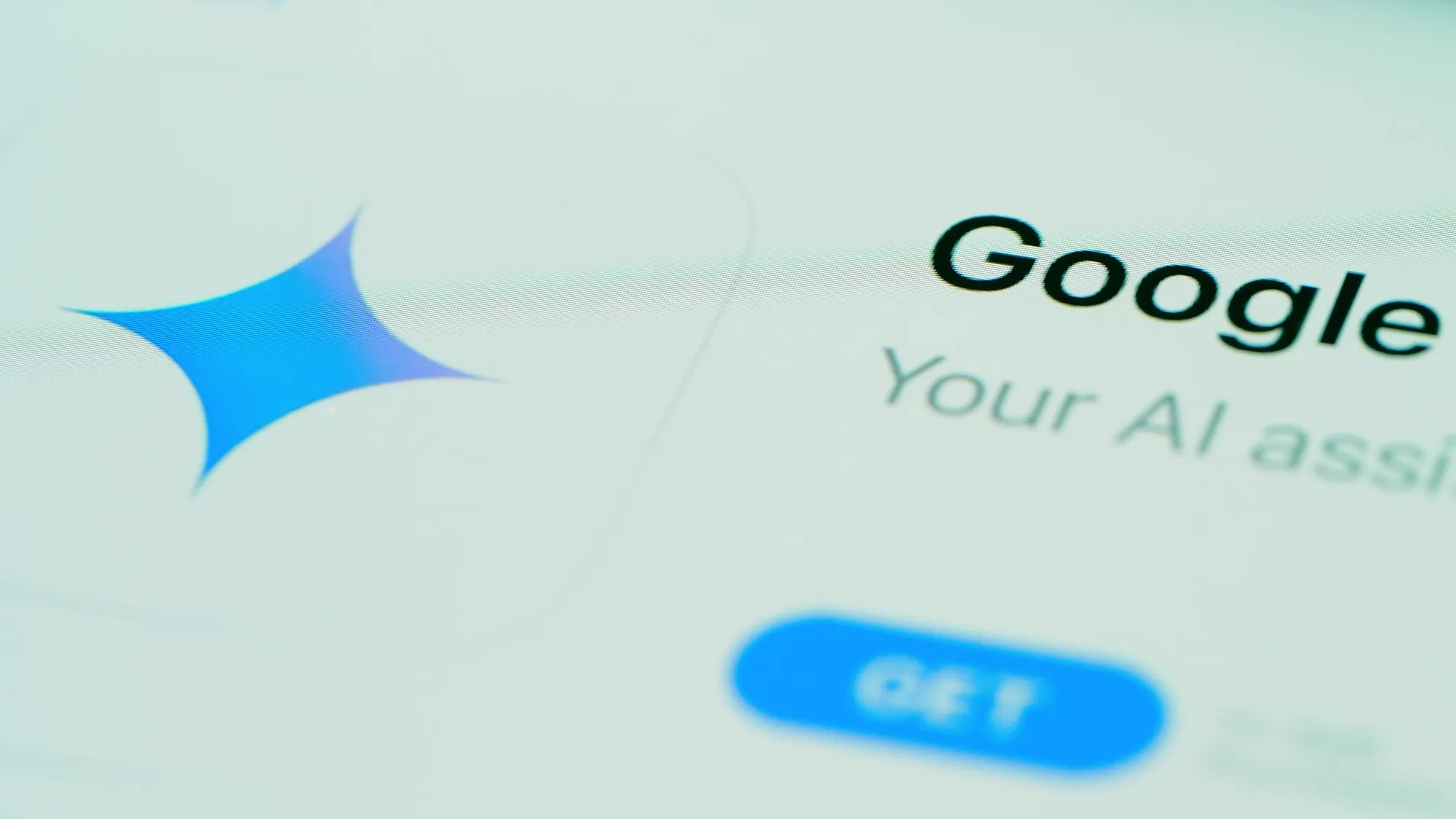Close-up of a screen showing the Google AI assistant sparkle icon next to the Google logo and a Get button