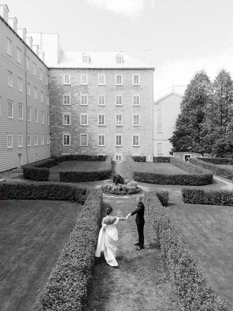 Newlyweds in a formal garden