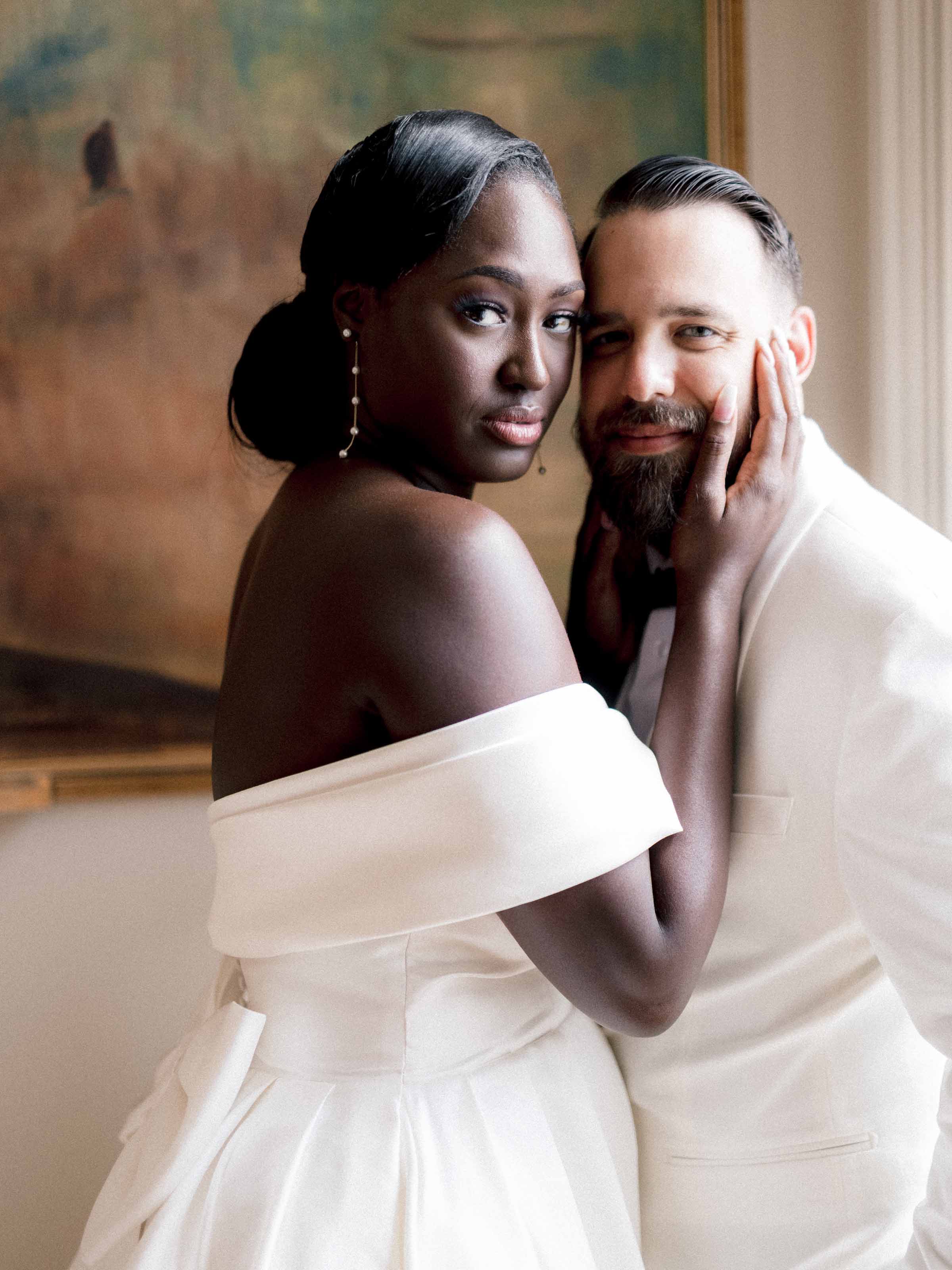 Bride looking to camera with the groom close beside her, Salle des Promotions, Québec City