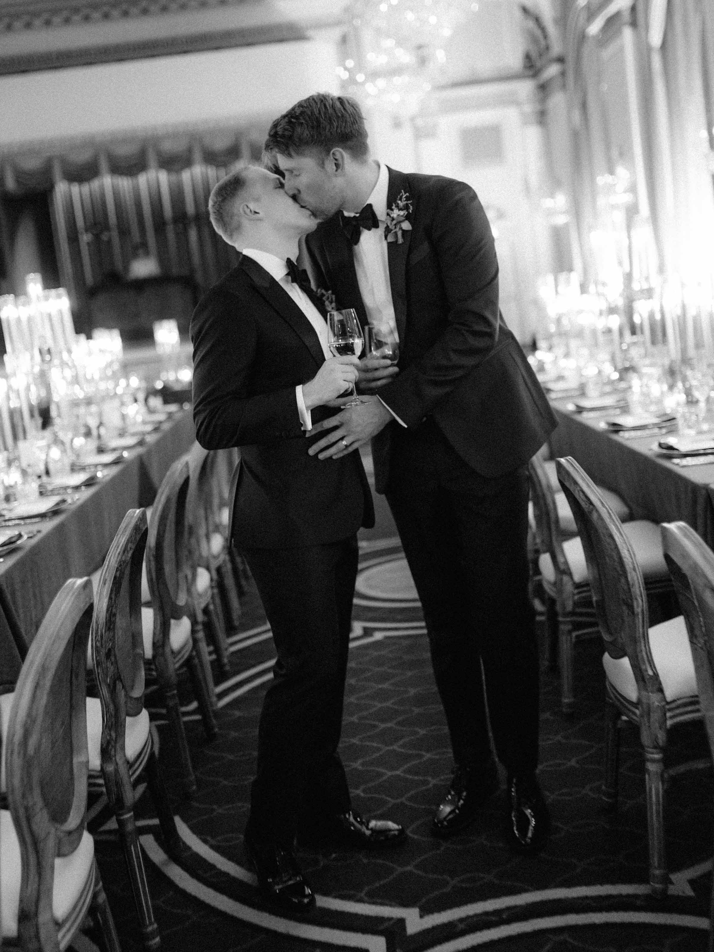 Couple kissing in a candlelit dining room, black and white, Fairmont Le Château Frontenac, Québec City