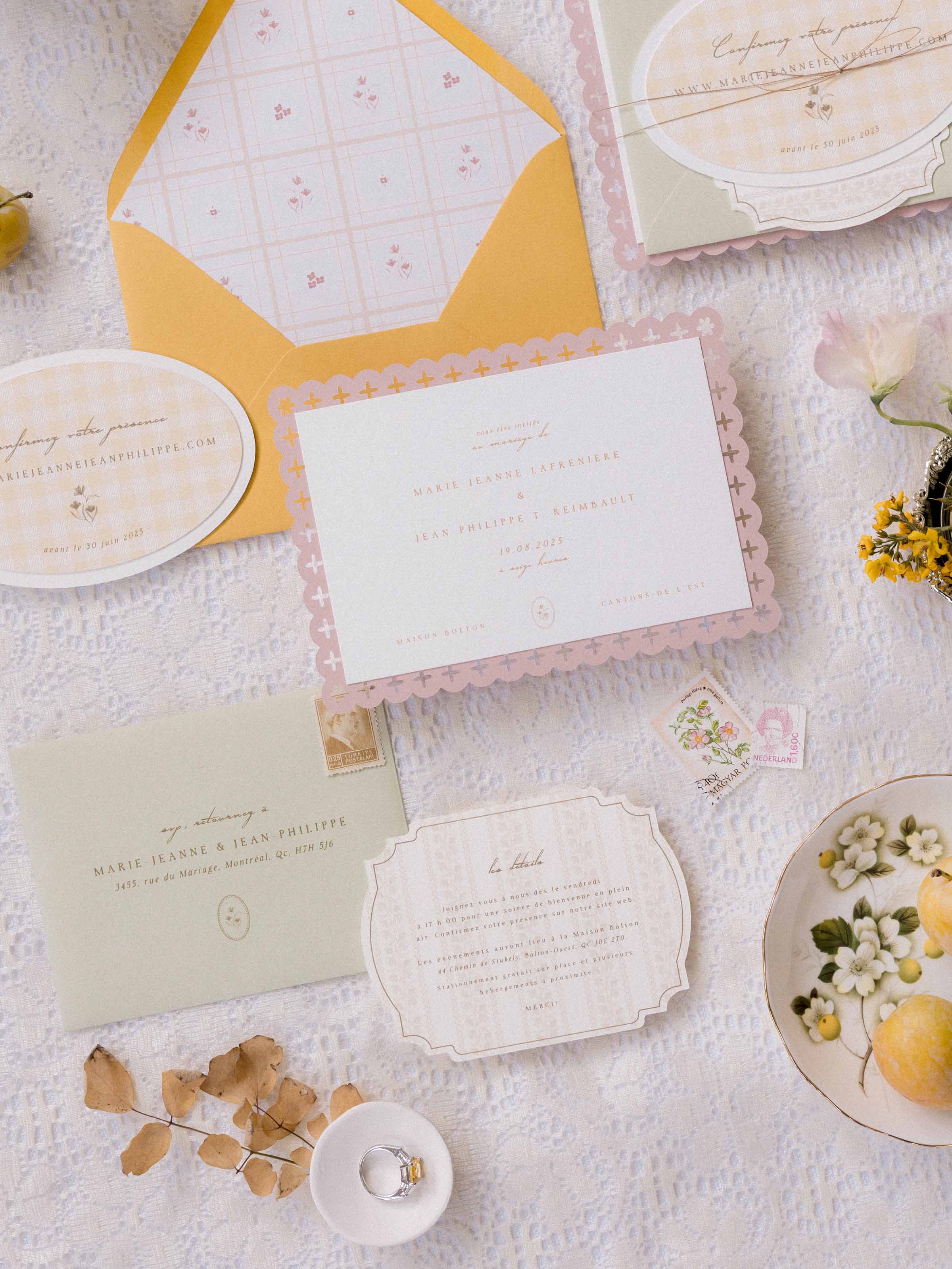 Wedding stationery flat lay with vintage stamps, pears and blossom, Maison Bolton, Eastern Townships