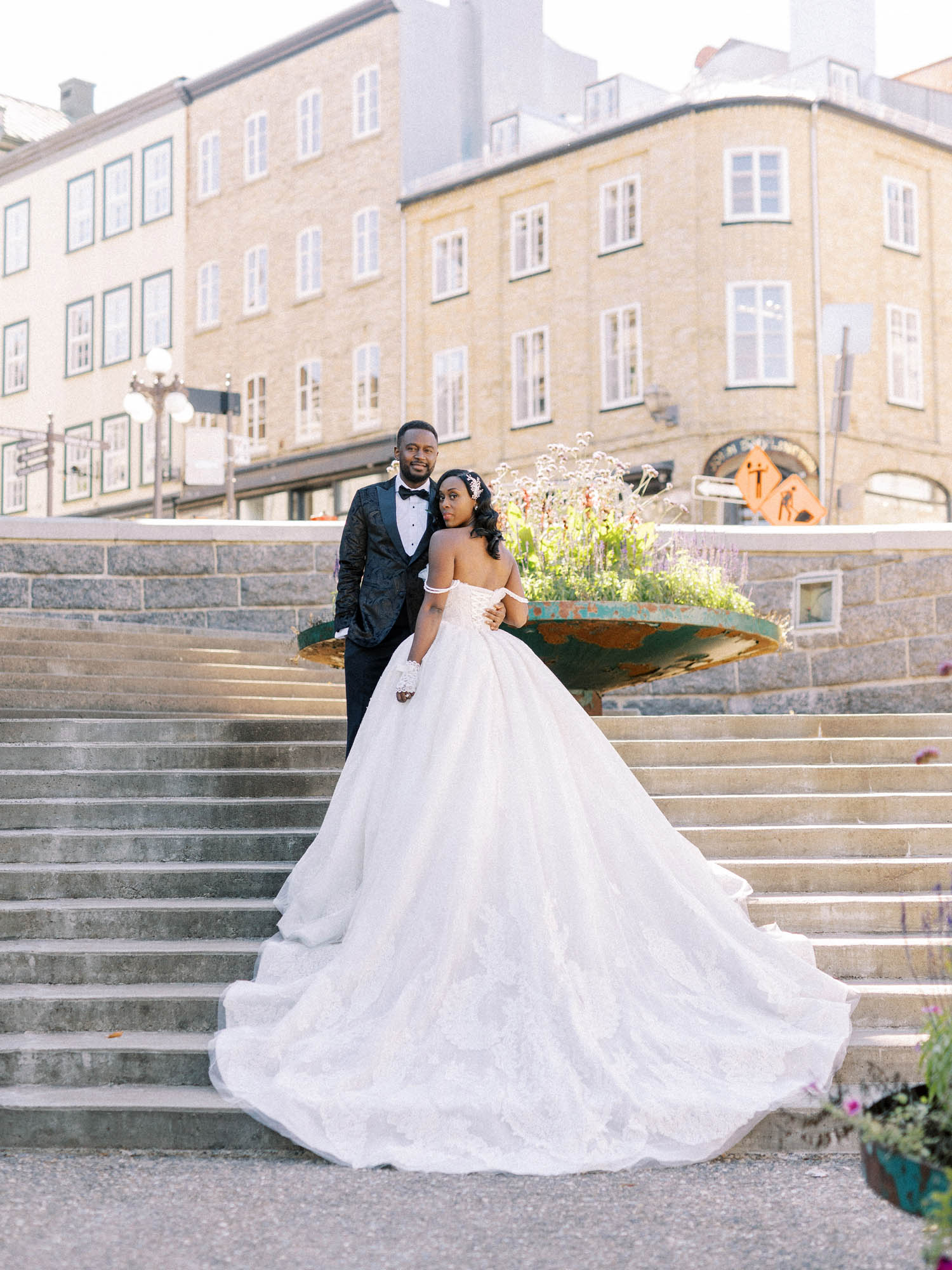 Bride and groom on stone steps in Old Quebec