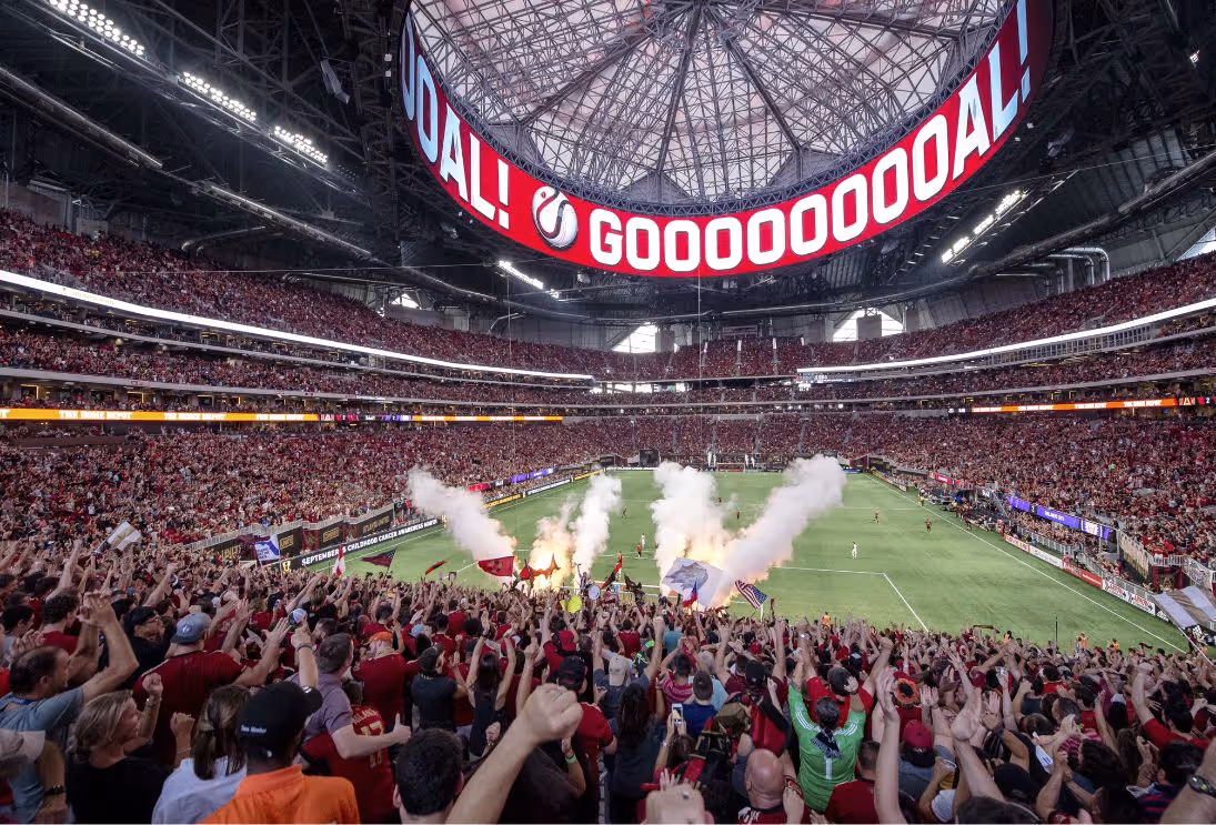 Atlanta United fans cheering at stadium during match