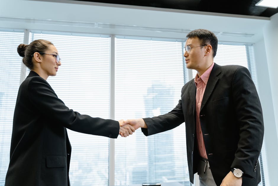 successful debt recovery handshake between business professionals in Dubai - debt collection process in dubai successful debt recovery handshake between business professionals in Dubai - debt collection process in dubai