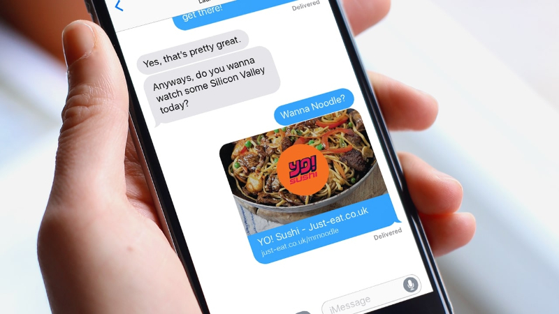 Text conversation on phone discussing watching Silicon Valley and sharing Yo! Sushi noodle dish link.