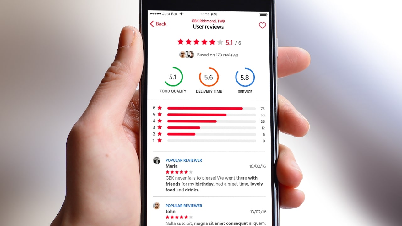 Hand holding phone displaying user reviews with star ratings for food quality, delivery time, and service.