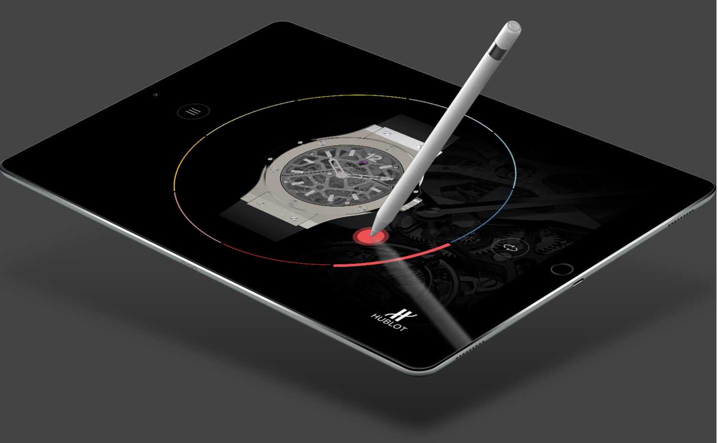 Digital tablet displaying a watch face with a stylus pointing at a red dot on a color ring.