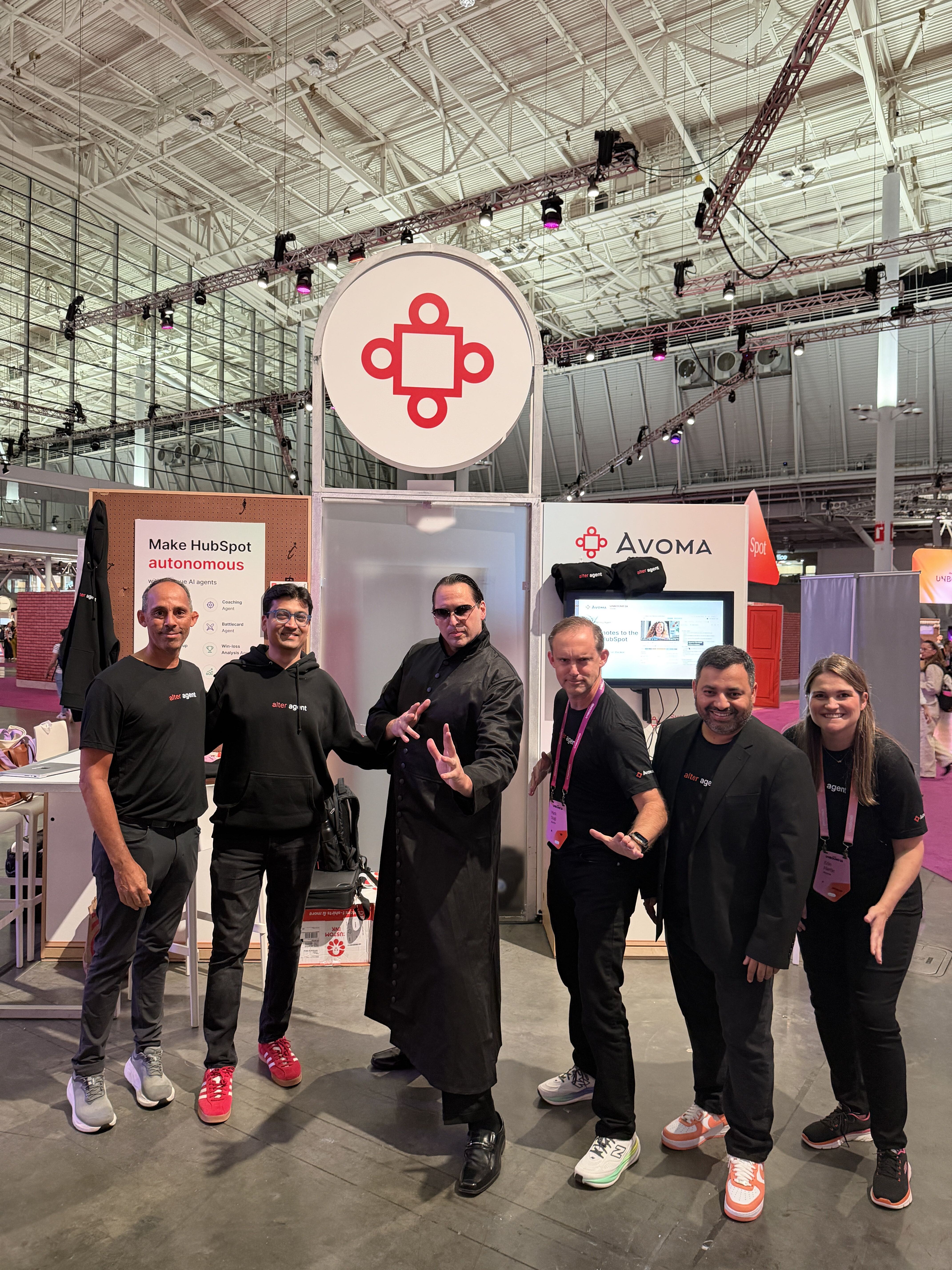 Neo poses with the Avoma team at the UNBOUND 2026 booth