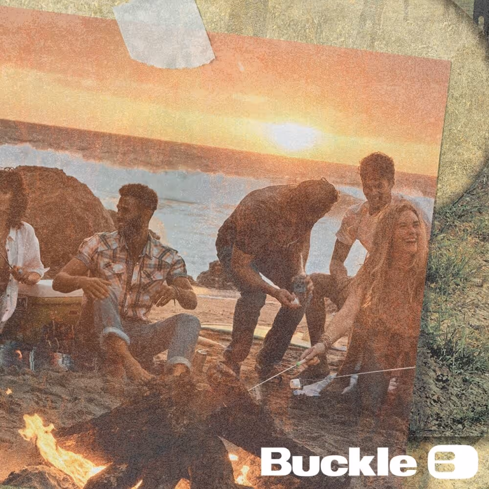 Photo of friends on a beach taped to a wall