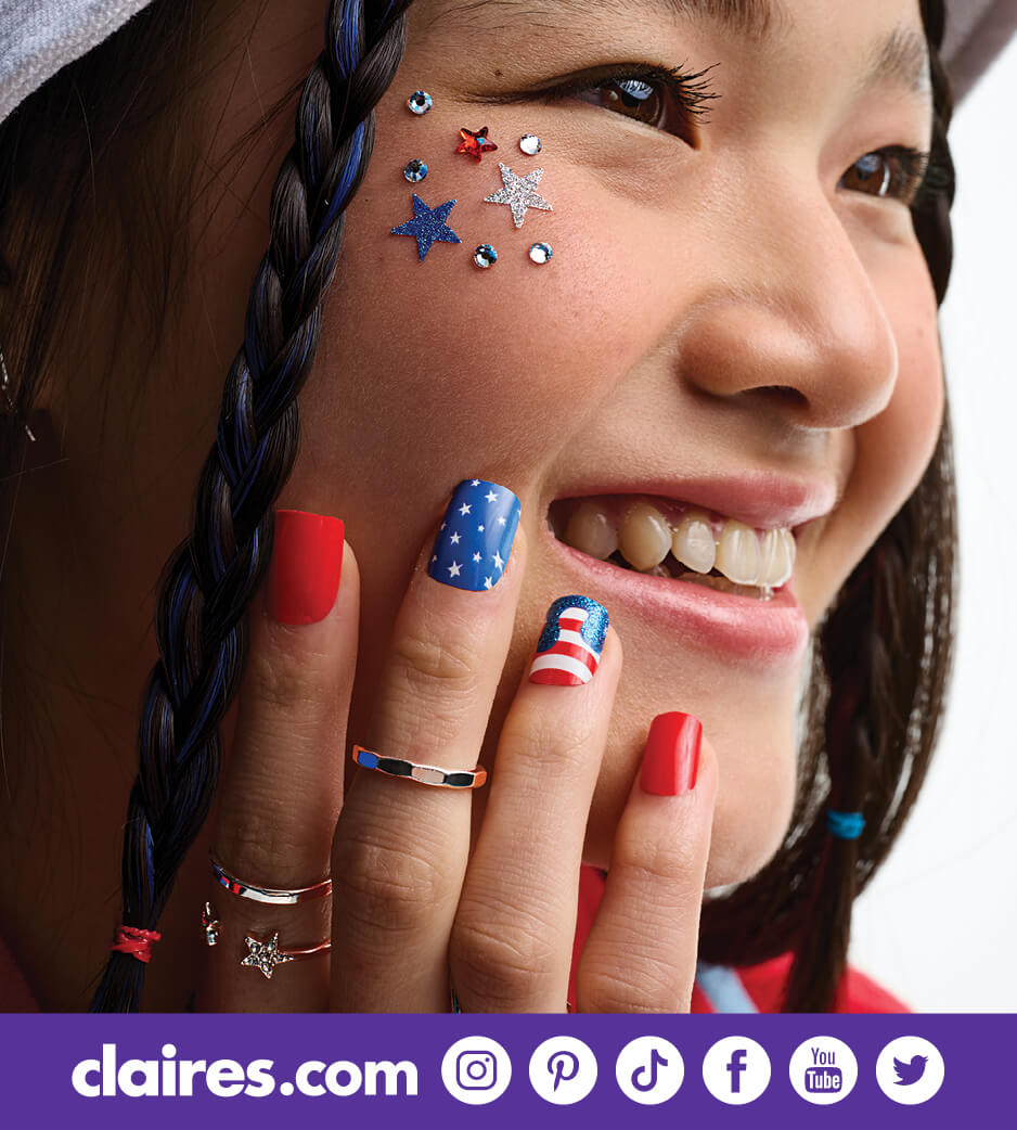 Young woman smiling with patriotic accessories