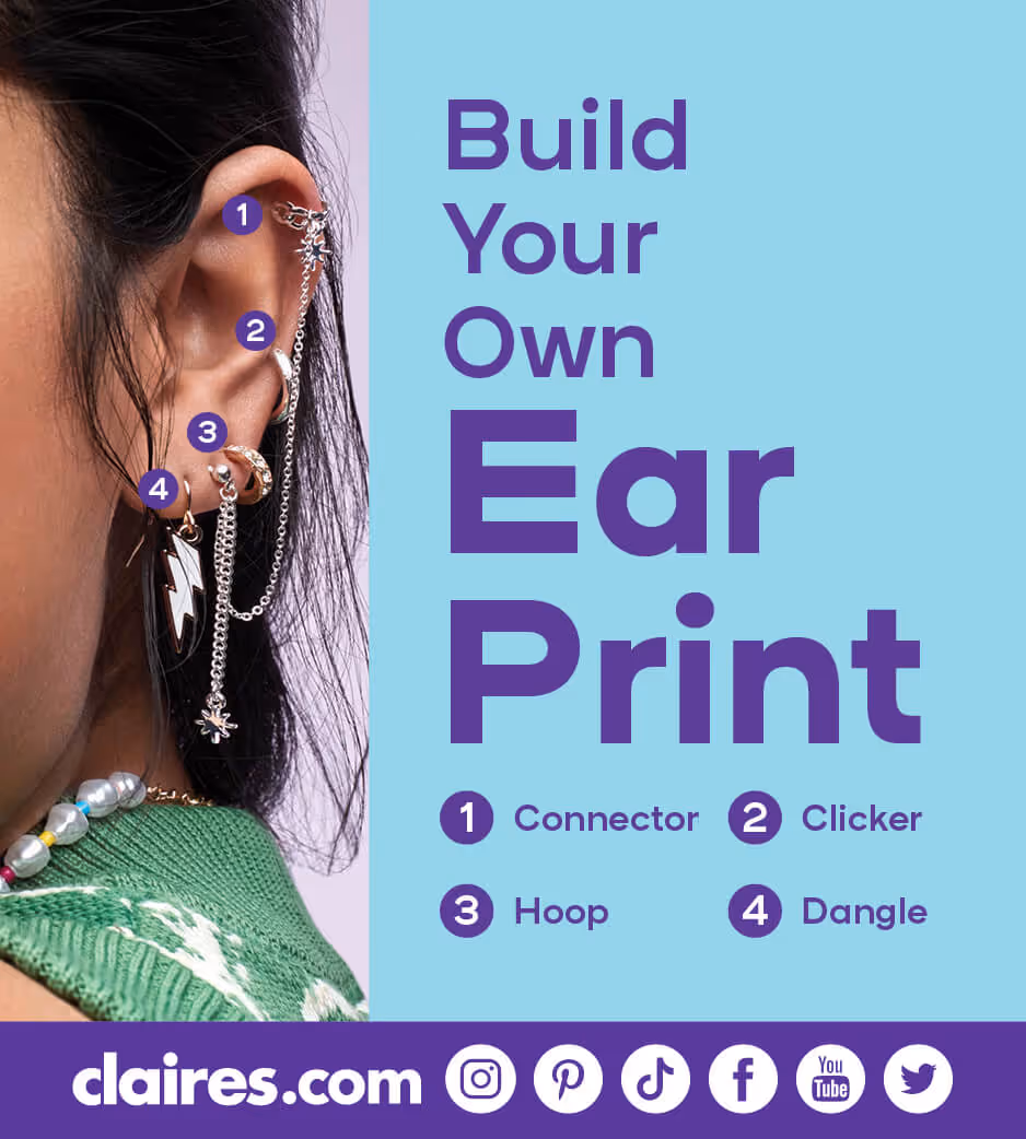 Closeup of a young lady's ear with a variety of piercings