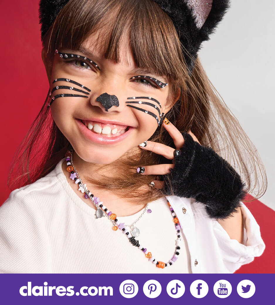 Young girl dressed up as a cat