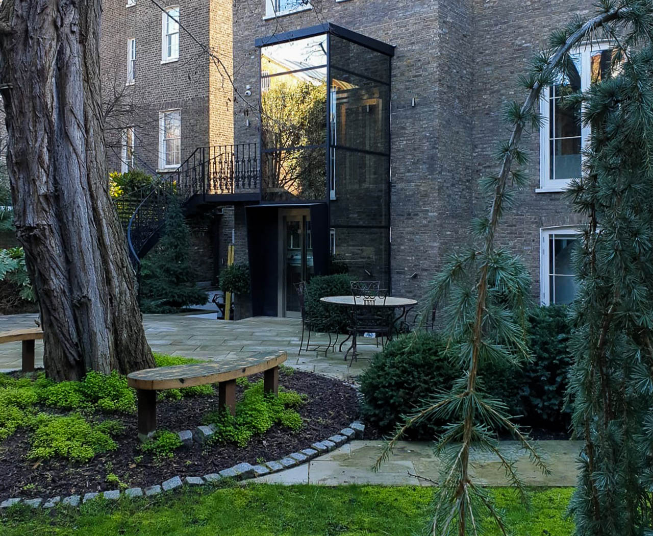 Outside lift for the home in a glass structure