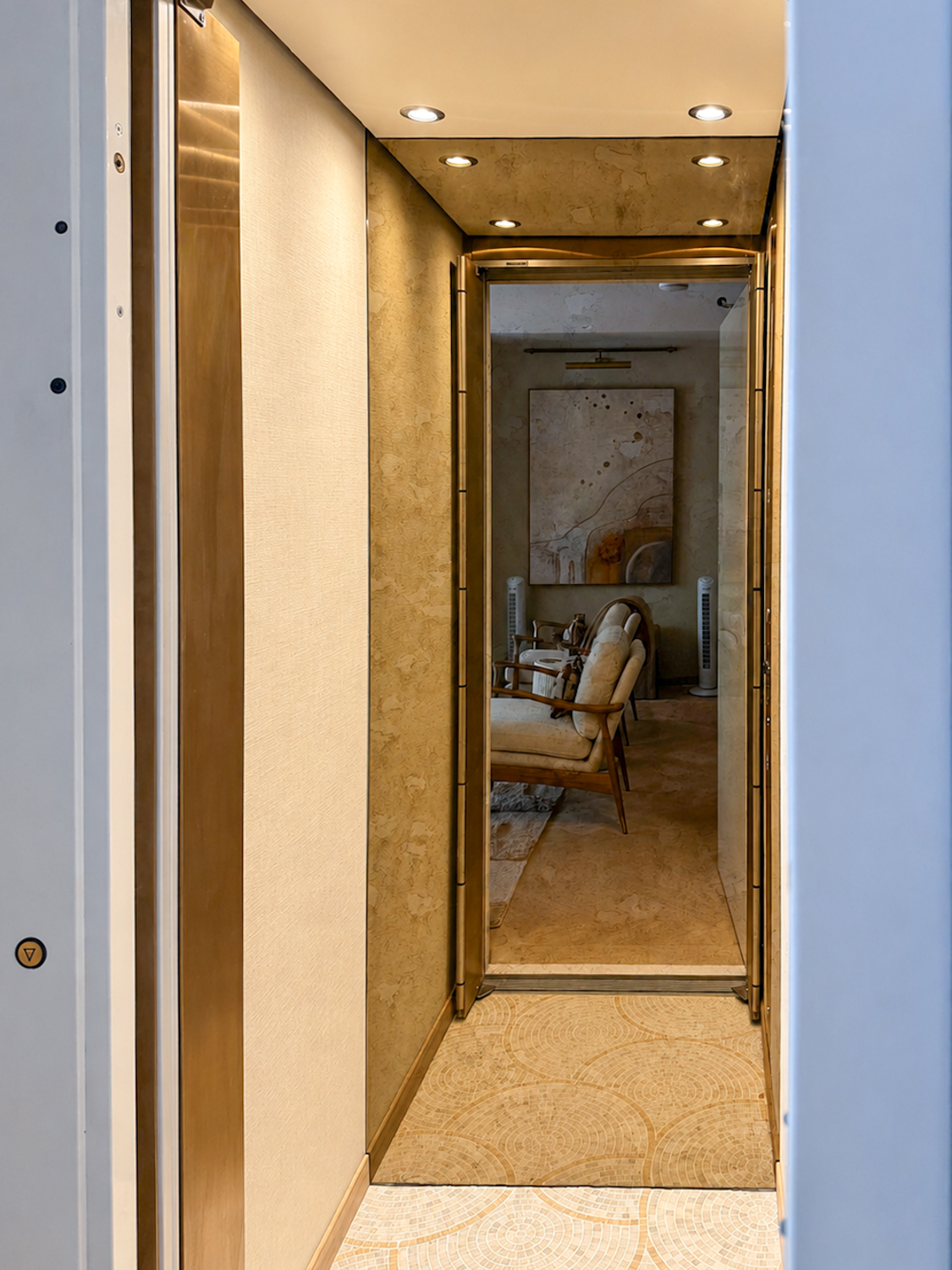 Home lift with Oro Satinato Gold finish and floor-to-ceiling mirror opening into an elegant period townhouse living space.