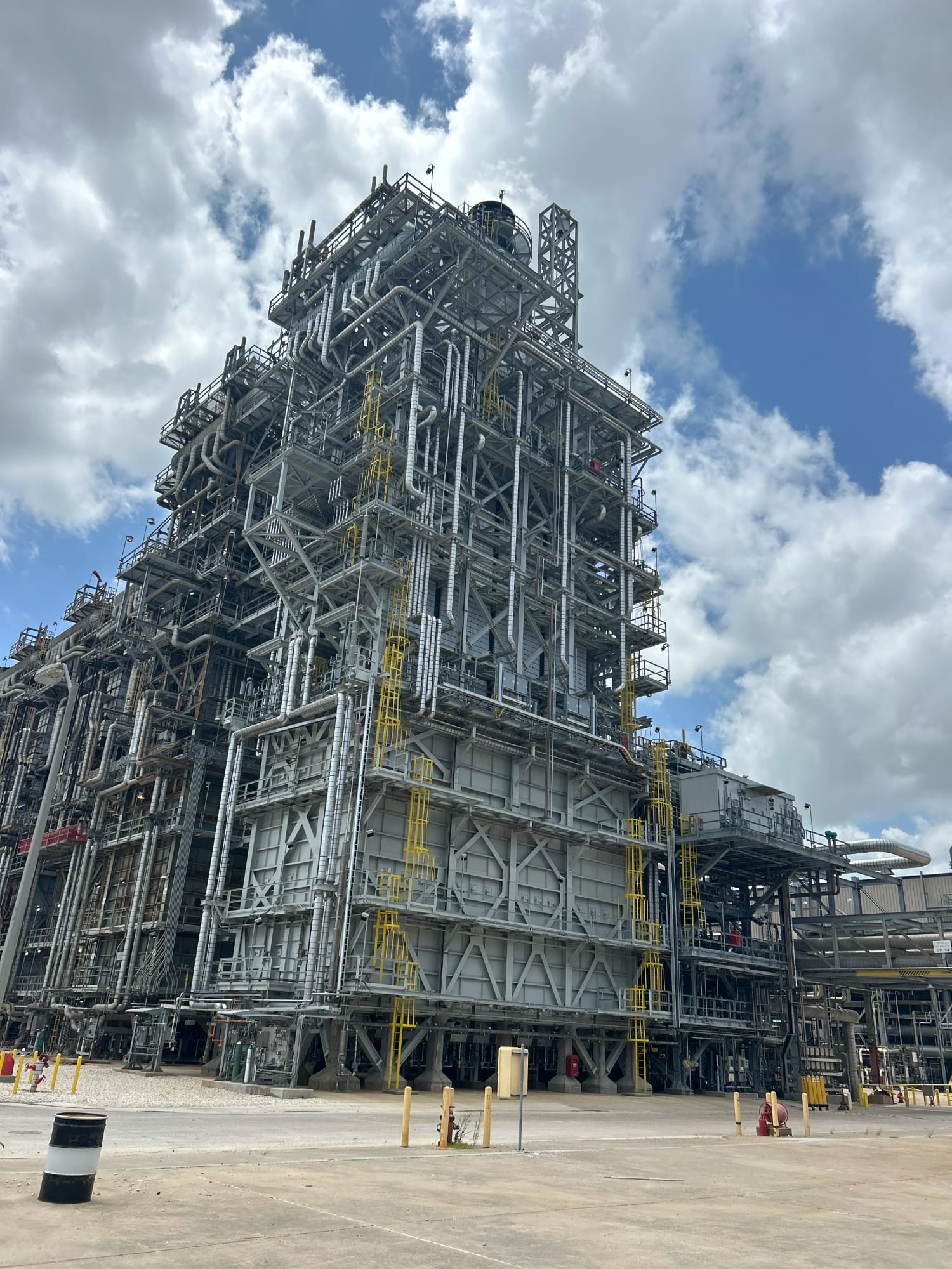 A ~10 story tower of pipes and industrial tubing.