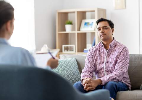 Man in a counselling session, discussing alcohol detox at a rehab centre at The Hader Clinic.