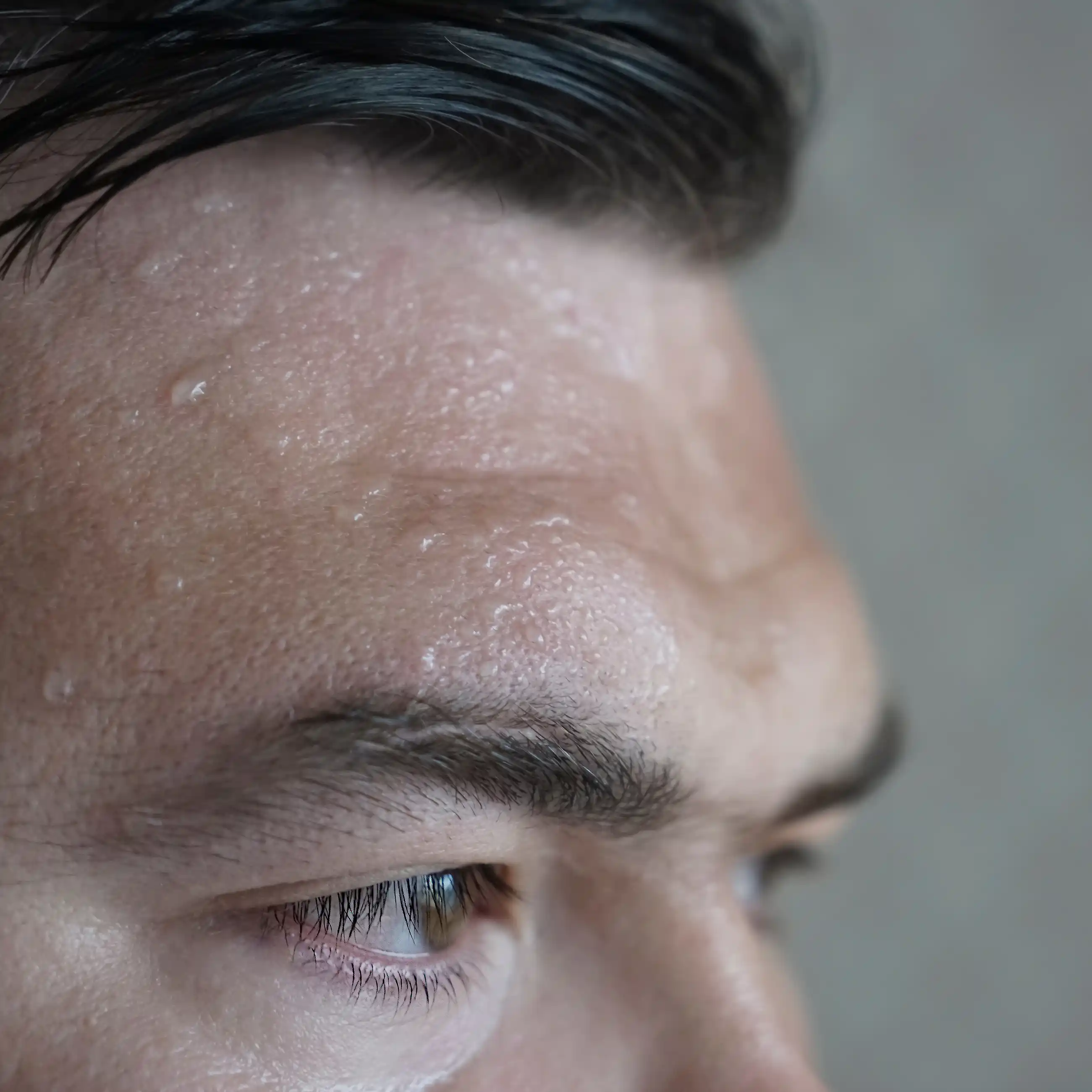 Sweat on the forehead of a man high on magic mushrooms, indicating the extreme anxiety he’s under.