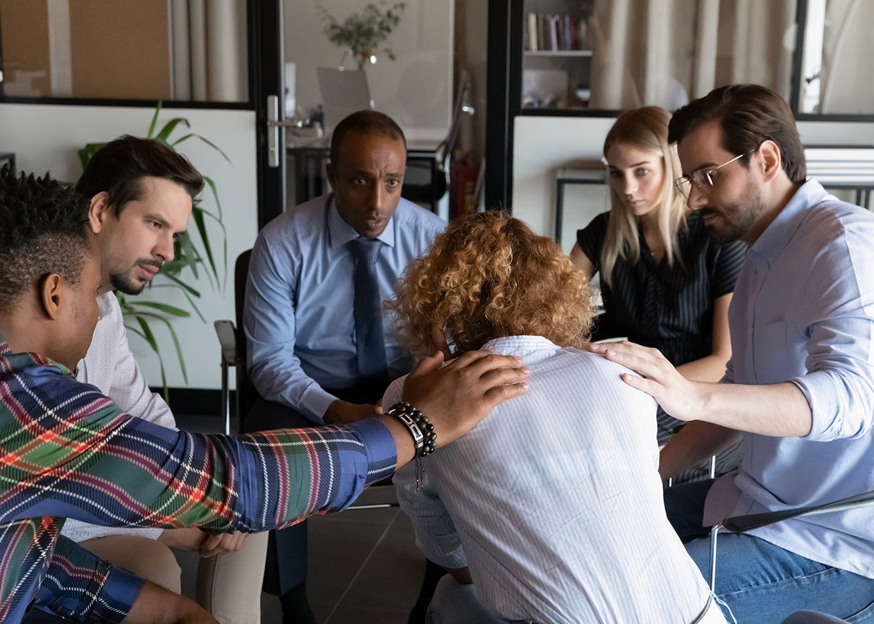 A rear-view of a family member undergoing depression due to addiction.