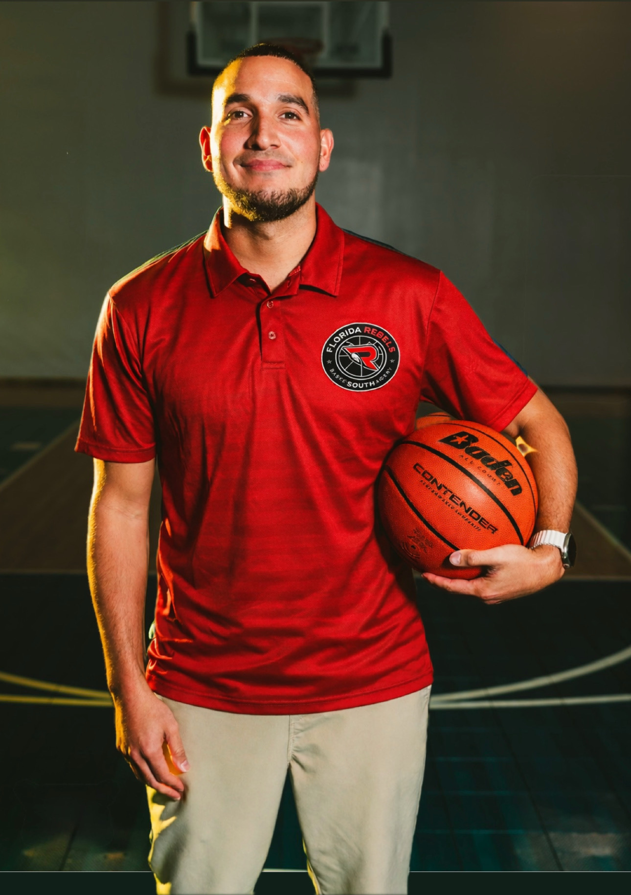 Michael Rios in red photo with a basketball