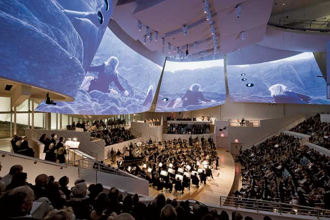 Curved acoustical plaster sails above a concert hall stage in Miami Beach, Florida