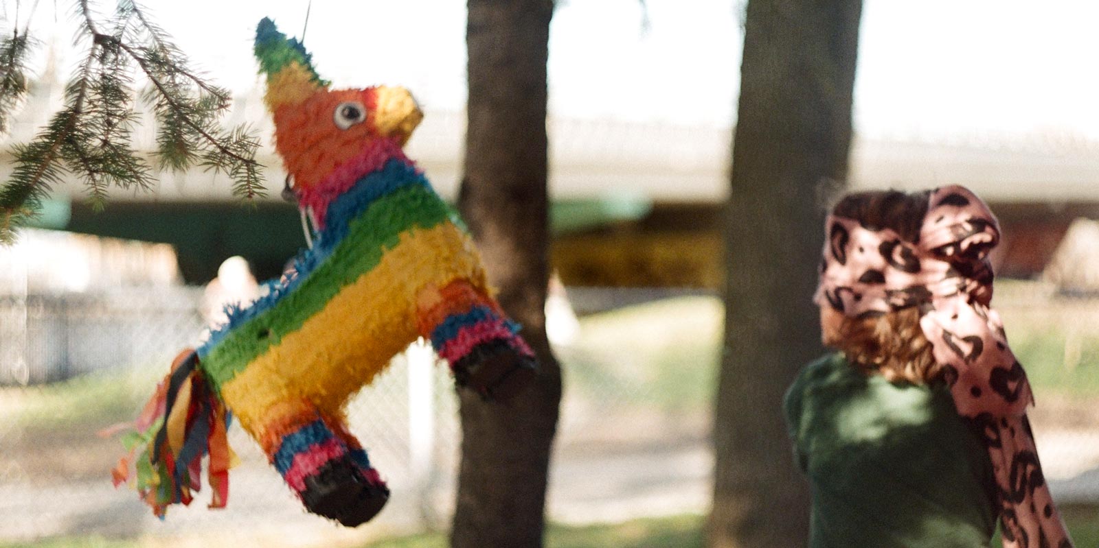 Photo of a child playing with a piñata