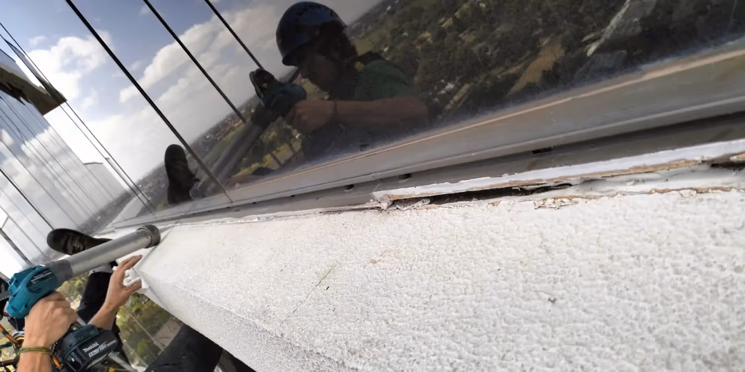 Bax Clean team on a rope access caulking job