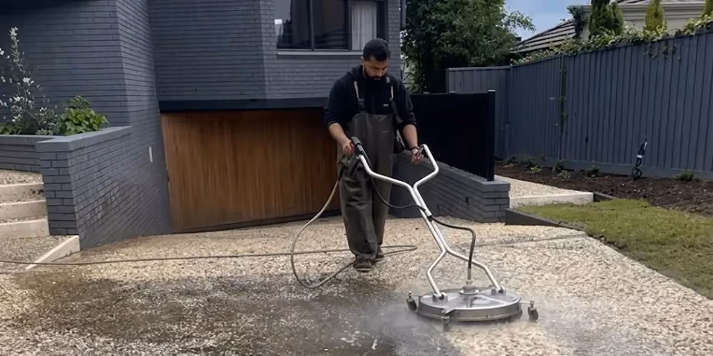 Professional pressure washing of residential driveway in Toorak.