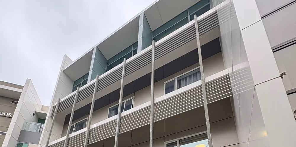 Exterior view of a modern aged care facility with professionally cleaned windows and building façade.