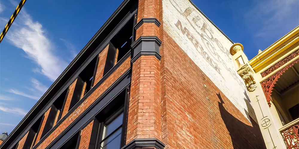 Restored heritage brick façade at the West Melbourne residential development.