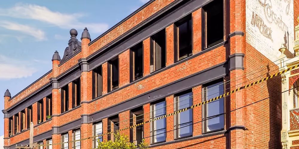 Street view of the heritage residential complex following exterior window cleaning in West Melbourne.