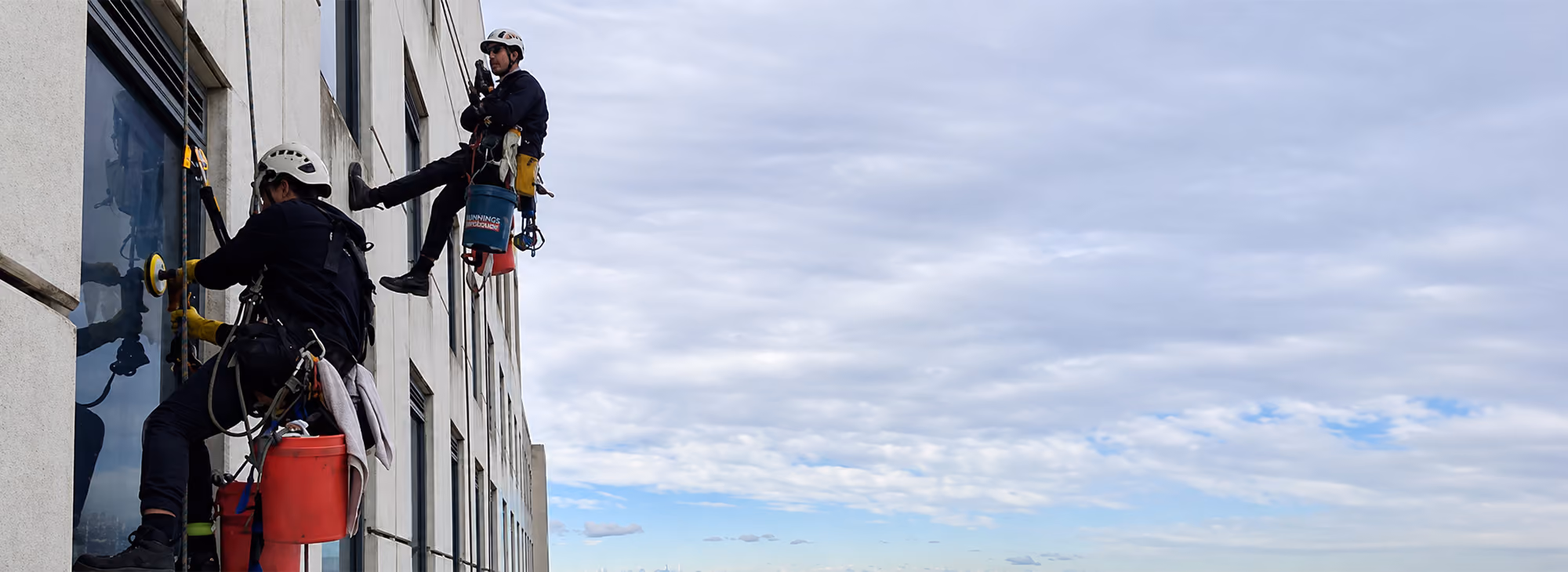 Rope access technicians cleaning the exterior windows of the Mantra Hotel Tullamarine.
