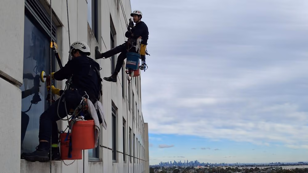 Bax Clean rope access technicians cleaning windows on Mantra Hotel Tullamarine