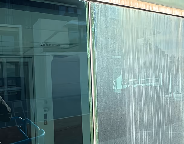 Before and after comparison of commercial window cleaning by Bax Clean