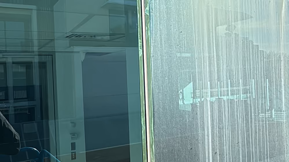 Before and after comparison of commercial window cleaning by Bax Clean