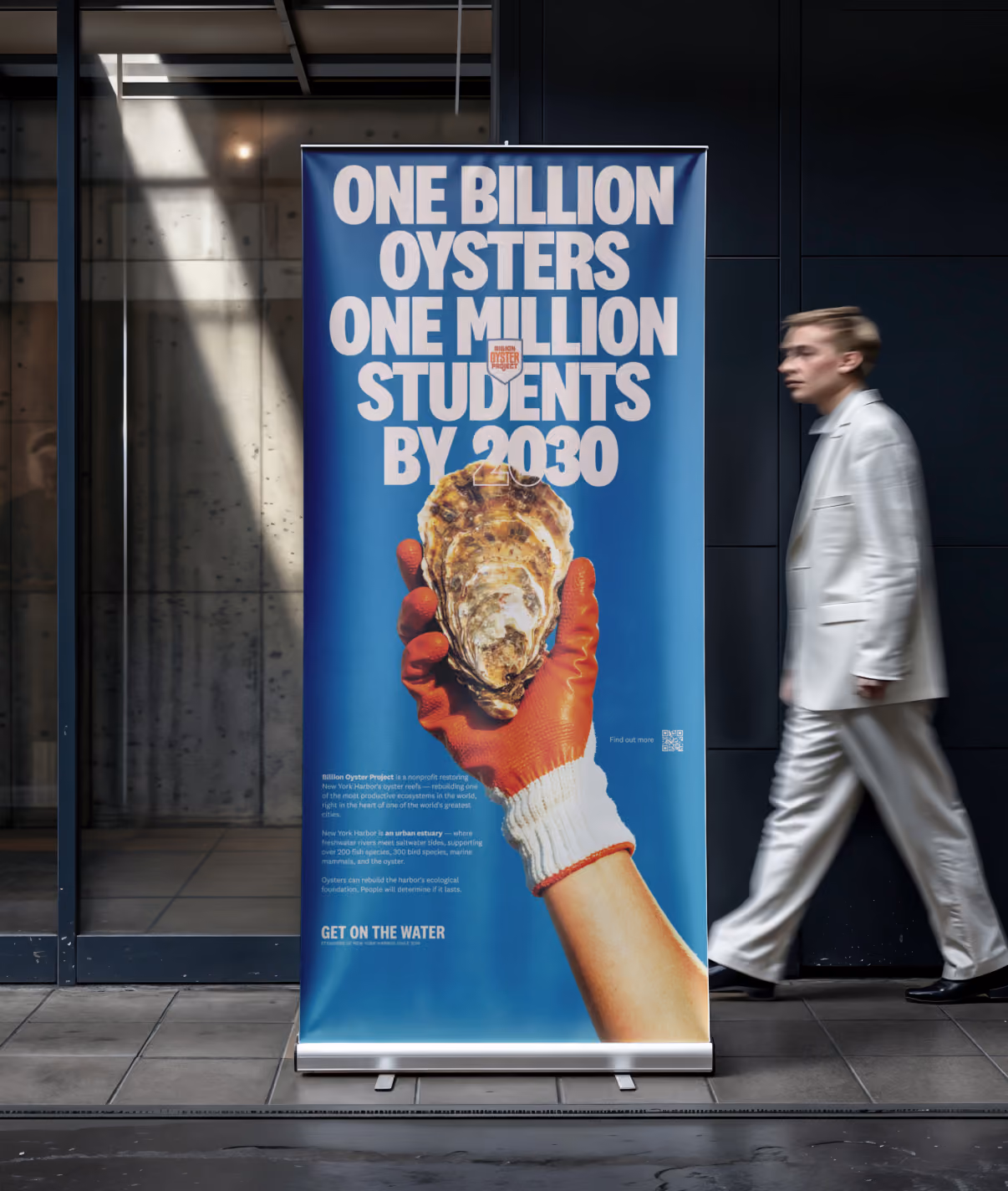 Roll-up banner: ‘One billion oysters, one million students by 2030’ above a gloved hand holding an oyster