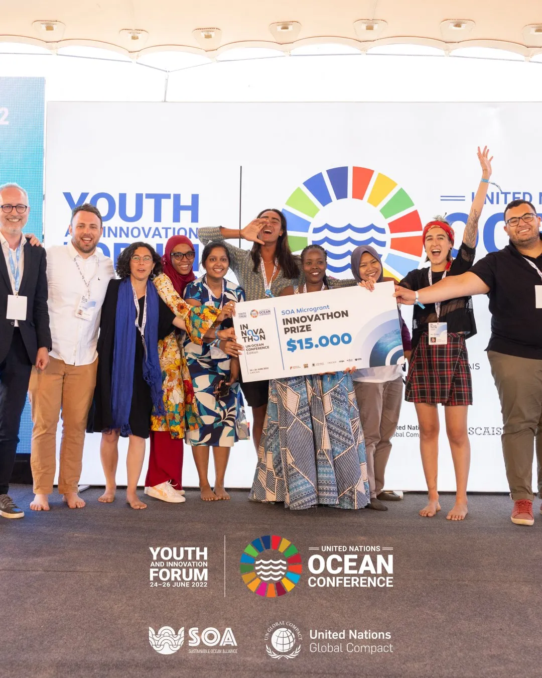Recap slide: an innovathon team on stage with the $15,000 prize cheque, under the Forum's branding